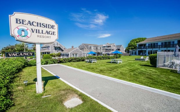 Photo of Resort Signage and building exterior and grounds.