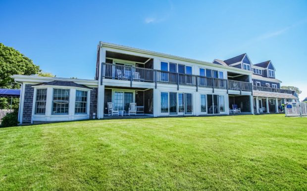 Photo of resort building exterior and green grass.