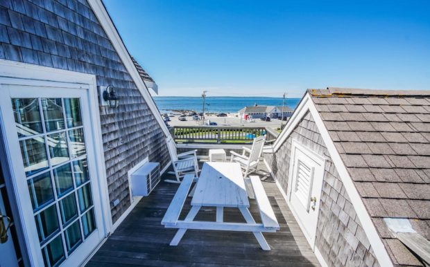 Photo of second floor porch with table and chairs