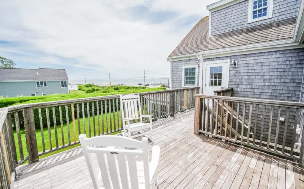 Photo of second floor porch with 2 chairs