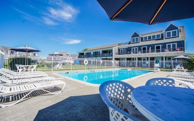 Photo of Inside pool area with tables and chairs