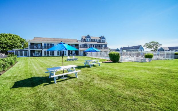 Photo of pool area and picnic tables