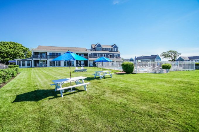 Photo of pool area and picnic tables