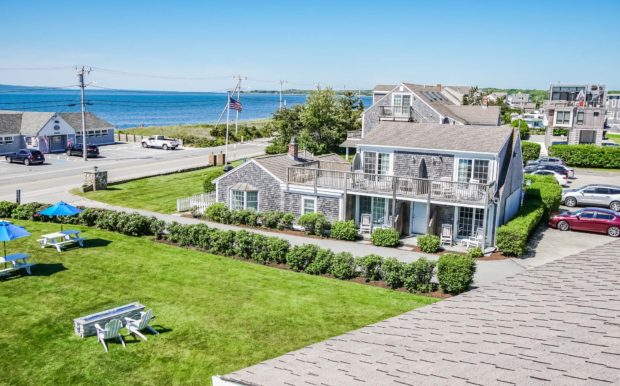 Photo of resort grounds, street and partial ocean view.